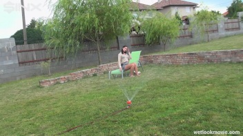Brunette's Very Wet Sprinkler Frolic Screencap 16 on www.sinx.com