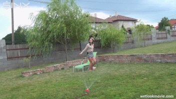 Brunette's Very Wet Sprinkler Frolic Screencap 17 on www.sinx.com