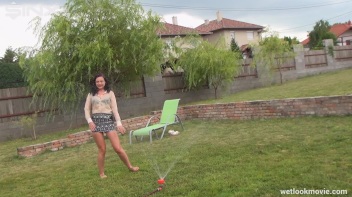 Brunette's Very Wet Sprinkler Frolic Screencap 18 on www.sinx.com