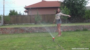 Brunette's Very Wet Sprinkler Frolic Screencap 21 on www.sinx.com