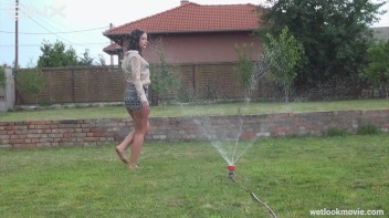 Brunette's Very Wet Sprinkler Frolic Screencap 22 on www.sinx.com