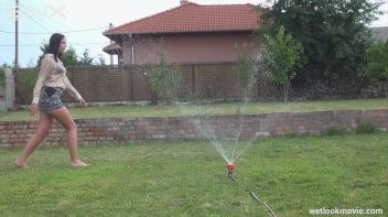 Brunette's Very Wet Sprinkler Frolic Screencap 24 on www.sinx.com