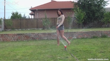 Brunette's Very Wet Sprinkler Frolic Screencap 26 on www.sinx.com