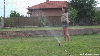 Brunette's Very Wet Sprinkler Frolic Screencap 31 on www.sinx.com