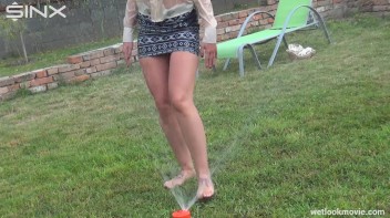 Brunette's Very Wet Sprinkler Frolic Screencap 34 on www.sinx.com