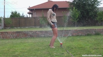 Brunette's Very Wet Sprinkler Frolic Screencap 35 on www.sinx.com