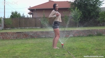 Brunette's Very Wet Sprinkler Frolic Screencap 39 on www.sinx.com