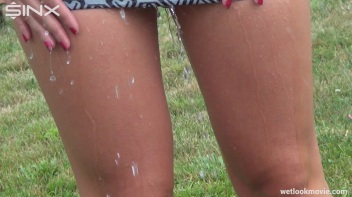 Brunette's Very Wet Sprinkler Frolic Screencap 48 on www.sinx.com