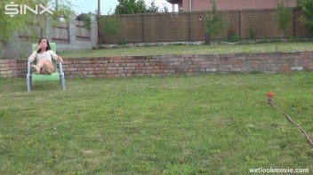 Brunette's Very Wet Sprinkler Frolic Screencap 5 on www.sinx.com