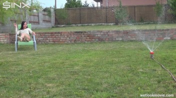 Brunette's Very Wet Sprinkler Frolic Screencap 6 on www.sinx.com