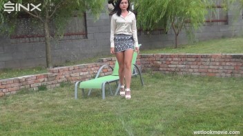 Brunette's Very Wet Sprinkler Frolic Screencap 11 on www.sinx.com