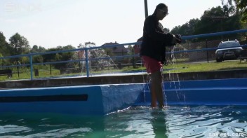 Waterpark Fun For Fully Clothed Brunette Babe Screencap 8 on www.sinx.com