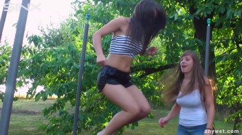 Cute Brunettes Get Drenched On Trampoline Screencap 10 on www.sinx.com