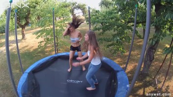 Cute Brunettes Get Drenched On Trampoline Screencap 12 on www.sinx.com