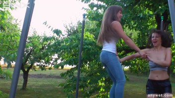 Cute Brunettes Get Drenched On Trampoline Screencap 13 on www.sinx.com