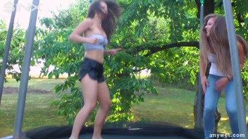 Cute Brunettes Get Drenched On Trampoline Screencap 2 on www.sinx.com