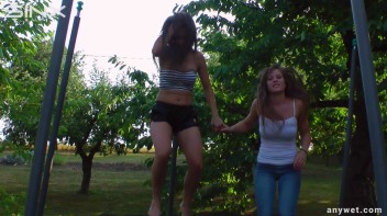 Cute Brunettes Get Drenched On Trampoline Screencap 33 on www.sinx.com