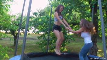Cute Brunettes Get Drenched On Trampoline Screencap 5 on www.sinx.com