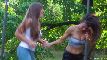 Cute Brunettes Get Drenched On Trampoline Screencap 6 on www.sinx.com