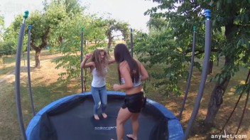 Cute Brunettes Get Drenched On Trampoline Screencap 8 on www.sinx.com