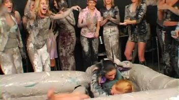 Two Dozen Babes Cheer On The Mud Fight Screencap 2 on www.sinx.com