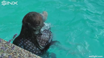 Three wild girls in pool cat fight Screencap 16 on www.sinx.com