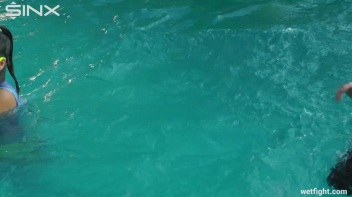 Three wild girls in pool cat fight Screencap 26 on www.sinx.com