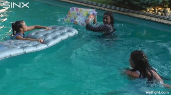 Three wild girls in pool cat fight Screencap 36 on www.sinx.com