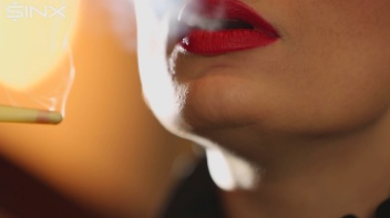 Seductive Babe With Red Lips Enjoys Smoking Screencap 11 on www.sinx.com
