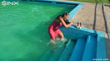Waterpark Fun For Fully Clothed Brunette Babe Screencap 26 on www.sinx.com