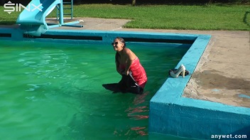 Waterpark Fun For Fully Clothed Brunette Babe Screencap 38 on www.sinx.com