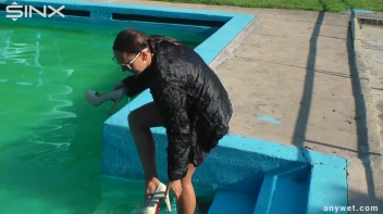 Waterpark Fun For Fully Clothed Brunette Babe Screencap 11 on www.sinx.com