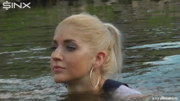 Seductive Blonde Smokes And Gets Drenched In Lake Screencap 37 on www.sinx.com