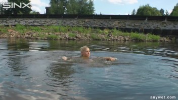 Seductive Blonde Smokes And Gets Drenched In Lake Screencap 39 on www.sinx.com