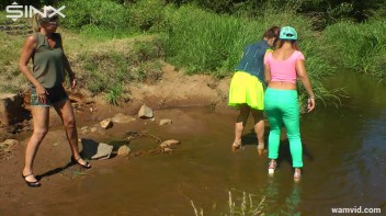 Three luscious ladies get soaked exercising in a river Screencap 18 on www.sinx.com