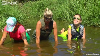 Three luscious ladies get soaked exercising in a river Screencap 65 on www.sinx.com