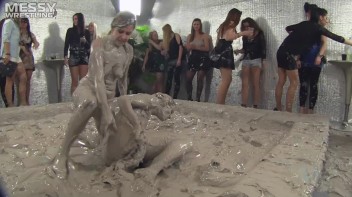 Muddy Wrestling: Satin, Skirts, and Audience Mud Blasted To The Max!  Everyone Gets A Taste! Screencap 57 on www.sinx.com