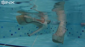 Fully Clothed Swimming For High Heeled Babe Screencap 21 on www.sinx.com