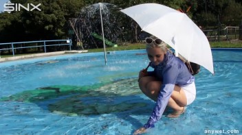 Playful Blonde Gets Drenched Under Water Fountain Screencap 16 on www.sinx.com