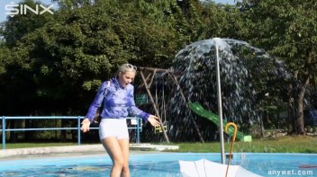 Playful Blonde Gets Drenched Under Water Fountain Screencap 18 on www.sinx.com
