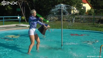 Playful Blonde Gets Drenched Under Water Fountain Screencap 19 on www.sinx.com