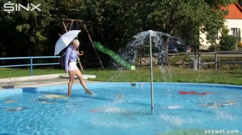 Playful Blonde Gets Drenched Under Water Fountain Screencap 2 on www.sinx.com
