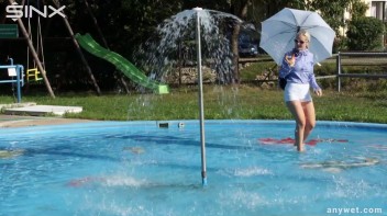 Playful Blonde Gets Drenched Under Water Fountain Screencap 3 on www.sinx.com
