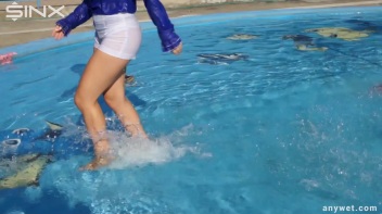 Playful Blonde Gets Drenched Under Water Fountain Screencap 36 on www.sinx.com