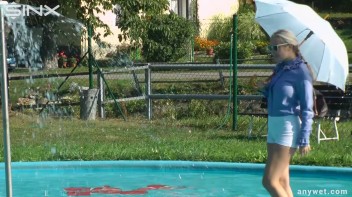 Playful Blonde Gets Drenched Under Water Fountain Screencap 4 on www.sinx.com