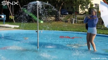 Playful Blonde Gets Drenched Under Water Fountain Screencap 5 on www.sinx.com