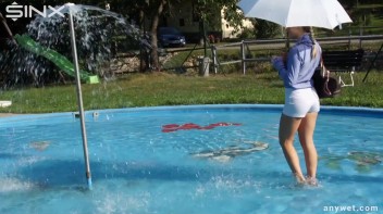 Playful Blonde Gets Drenched Under Water Fountain Screencap 6 on www.sinx.com