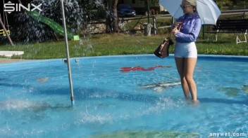 Playful Blonde Gets Drenched Under Water Fountain Screencap 7 on www.sinx.com