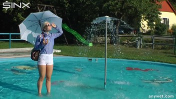 Playful Blonde Gets Drenched Under Water Fountain Screencap 10 on www.sinx.com