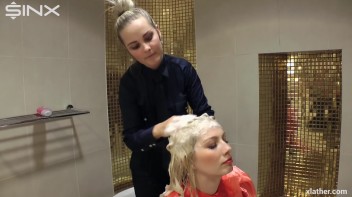 Blondes shampoo each other in a tub Screencap 13 on www.sinx.com